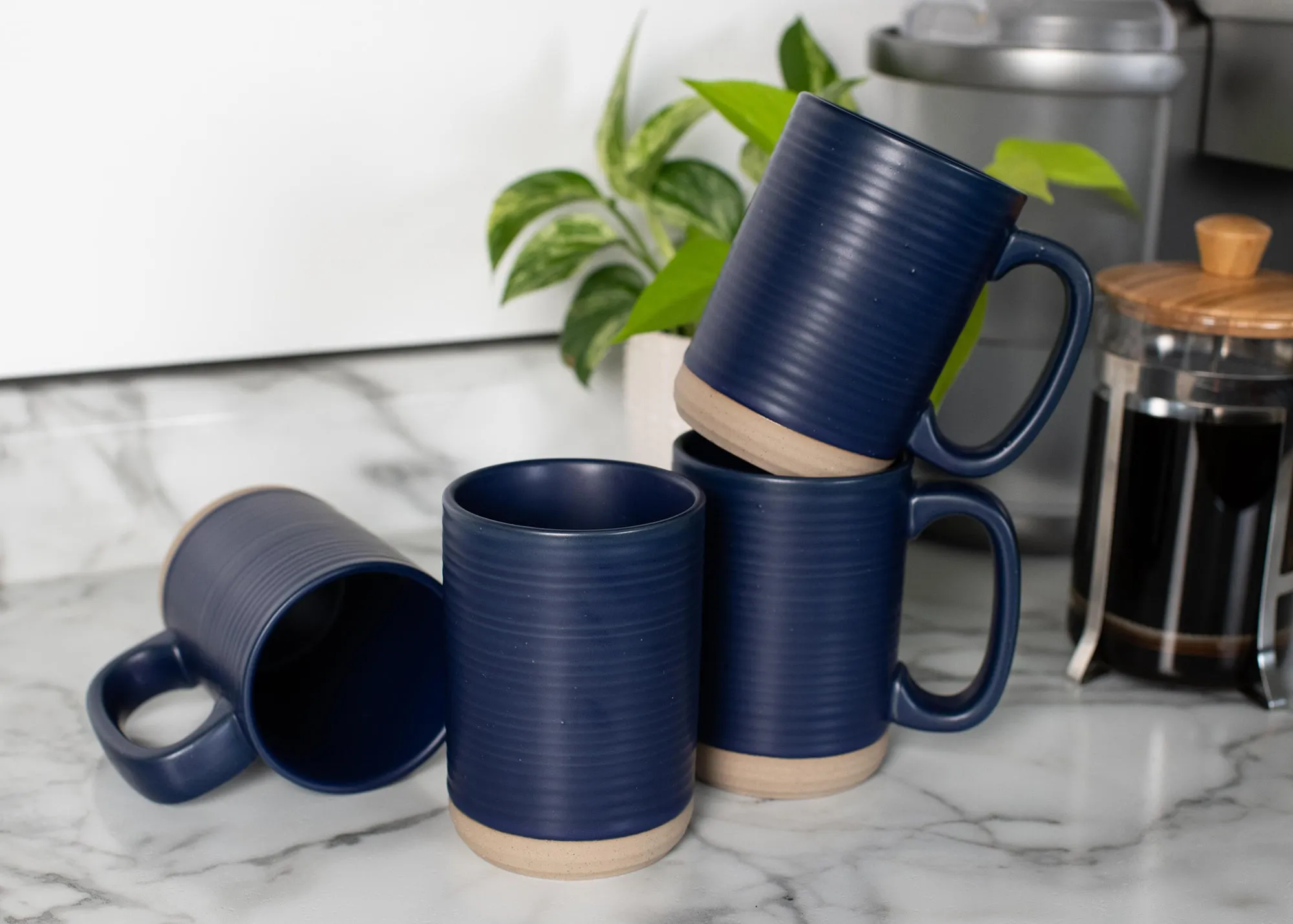 Elanze Designs Tall Ribbed Raw Clay Bottom Navy Blue 16 ounce Ceramic Coffee Mugs Set of 4