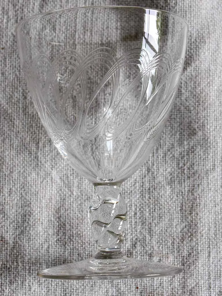 Nine mid-century white wine glasses with pretty engraving